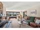 Open living room featuring a billiard table and large windows with stunning views at 6 Blue Grouse Ridge Rd, Littleton, CO 80127