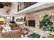 Living room with a stone fireplace at 6 Blue Grouse Ridge Rd, Littleton, CO 80127