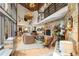 Bright living room with a stone fireplace at 6 Blue Grouse Ridge Rd, Littleton, CO 80127