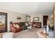Inviting living room with a comfortable leather sofa and neutral decor for relaxation at 6 Blue Grouse Ridge Rd, Littleton, CO 80127