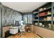 Stylish home office with custom shelving and a modern workstation at 6 Blue Grouse Ridge Rd, Littleton, CO 80127