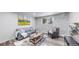 Comfortable living room with stylish furniture, a stone wall, and a bright window at 8826 E Florida Ave # G12, Denver, CO 80247