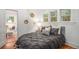 Comfortable bedroom with natural light, cozy bedding, and a decorative rug at 3019 Meade St, Denver, CO 80211