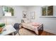 bedroom featuring playful decor, natural light, and hardwood floors at 3019 Meade St, Denver, CO 80211