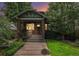 Charming brick home featuring a landscaped front yard and inviting porch at 3019 Meade St, Denver, CO 80211