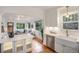 Open kitchen and living area with island featuring modern cabinets and stainless steel appliances at 3019 Meade St, Denver, CO 80211