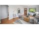Open-concept living area with hardwood floors, natural light, and charming details at 3019 Meade St, Denver, CO 80211