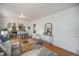 Open-concept living space featuring hardwood floors and seamless access to kitchen at 3019 Meade St, Denver, CO 80211