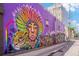 Eye-catching building mural with vibrant colors and unique artistic design along a neighborhood alleyway at 3019 Meade St, Denver, CO 80211