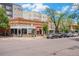 Commercial street view displaying various retail storefronts, street parking, and pedestrian access for convenient shopping at 3019 Meade St, Denver, CO 80211