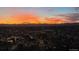 Sunset aerial view of city showing a colorful skyline over urban landscape, with mountains in background at 1551 Larimer St # 2602, Denver, CO 80202