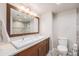 Modern bathroom with a double sink vanity, large mirror, and tiled walk-in shower at 1551 Larimer St # 2602, Denver, CO 80202