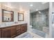 Bright bathroom with a double vanity, granite countertops, and luxurious glass-enclosed shower at 1551 Larimer St # 2602, Denver, CO 80202