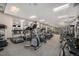 Modern gym with a variety of treadmills, elliptical machines, weights and mirrored walls at 1551 Larimer St # 2602, Denver, CO 80202