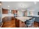 Beautiful kitchen features a center island with seating, stainless appliances, and plenty of cabinet space at 1551 Larimer St # 2602, Denver, CO 80202