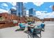 Modern rooftop patio with comfortable seating around a fire pit, perfect for entertaining at 1551 Larimer St # 2602, Denver, CO 80202