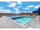 Rooftop pool with clear blue water and lounge chairs, perfect for relaxation at 1551 Larimer St # 2602, Denver, CO 80202