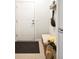 Inviting entryway featuring a white door, storage bench, and stylish decor, creating a warm and welcoming ambiance at 3339 Lowell Blvd, Denver, CO 80211