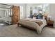 Sun-filled main bedroom featuring a barn door to the ensuite bathroom and a large window at 3339 Lowell Blvd, Denver, CO 80211