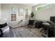 Bright home office featuring modern decor, neutral colors, and large windows for natural light at 3339 Lowell Blvd, Denver, CO 80211