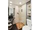 Sleek and modern shower design with unique tile work, glass enclosure, and contemporary fixtures at 3339 Lowell Blvd, Denver, CO 80211