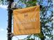 A welcoming sign for Highland Square, inviting visitors to come and stay awhile at 3339 Lowell Blvd, Denver, CO 80211