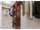 Spacious walk-in closet with custom wood shelving provides ample storage and organization for clothes and accessories at 3009 Madison Ave # K317, Boulder, CO 80303