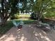 Outdoor patio has mature trees, furniture set and is perfect for entertaining or relaxation at 10386 Ravenswood Way, Highlands Ranch, CO 80130