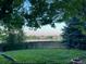 Scenic backyard view of lawn, ball field and mountains in the distance at 10386 Ravenswood Way, Highlands Ranch, CO 80130