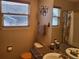 Bathroom features a vessel sink, window, bath with shower and neutral color scheme at 10386 Ravenswood Way, Highlands Ranch, CO 80130
