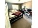 This bedroom features carpet, an overhead light, and a large window for natural light at 10386 Ravenswood Way, Highlands Ranch, CO 80130