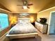 This bedroom features carpet, overhead fan, a picture window, and nice decor at 10386 Ravenswood Way, Highlands Ranch, CO 80130