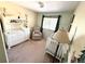 Bright Bedroom with a white crib, changing table and neutral decor at 10386 Ravenswood Way, Highlands Ranch, CO 80130