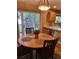 Breakfast nook with bright light offering backyard views and adjacent to the kitchen's breakfast bar at 10386 Ravenswood Way, Highlands Ranch, CO 80130