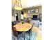 Open layout showcasing the dining area connecting to the living room, creating a cohesive and inviting space at 10386 Ravenswood Way, Highlands Ranch, CO 80130