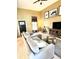 Spacious living room with tall ceilings, modern decor, plush seating, and lots of natural light at 10386 Ravenswood Way, Highlands Ranch, CO 80130