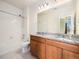 Clean bathroom with dual sinks, granite countertops, and shower/tub combo at 5755 S Buchanan Ct # E, Aurora, CO 80016