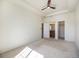 Spacious bedroom with carpeted floor and bathroom access at 5755 S Buchanan Ct # E, Aurora, CO 80016