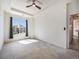 Bright main bedroom with large windows and a view of the neighborhood at 5755 S Buchanan Ct # E, Aurora, CO 80016