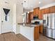 Updated kitchen with granite countertops, stainless steel appliances, and stylish pendant lighting at 5755 S Buchanan Ct # E, Aurora, CO 80016
