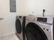 Modern laundry room featuring a Samsung washer and dryer set for efficient laundry care at 5755 S Buchanan Ct # E, Aurora, CO 80016