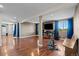 Spacious finished basement with hardwood flooring, windows, and neutral paint at 17925 E Maplewood Dr, Aurora, CO 80016