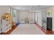 Basement featuring hardwood floors, comfortable seating, and ample storage at 17925 E Maplewood Dr, Aurora, CO 80016