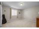 Cozy bedroom with carpet flooring, a window, and neutral wall color at 17925 E Maplewood Dr, Aurora, CO 80016