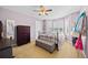 Bedroom with a metal bed frame, lots of natural light and a neutral color palette at 17925 E Maplewood Dr, Aurora, CO 80016