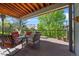 Inviting covered deck with comfortable seating and mountain views offers a relaxing outdoor retreat at 17925 E Maplewood Dr, Aurora, CO 80016