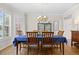 Formal dining area featuring hardwood floors, a beautifully set dining table, and elegant decor at 17925 E Maplewood Dr, Aurora, CO 80016