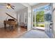 Welcoming entryway with hardwood floors, a piano, and an open view to the exterior at 17925 E Maplewood Dr, Aurora, CO 80016
