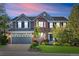Charming two-story home featuring brick and siding, complemented by a well-maintained lawn and professional landscaping at 17925 E Maplewood Dr, Aurora, CO 80016