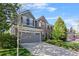 Attractive two-story home featuring brick and siding, a spacious driveway, and well-manicured landscaping at 17925 E Maplewood Dr, Aurora, CO 80016